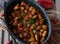 Sausage goulash, spicy hungarian style in a rustic pot