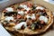 Sausage and meatball pizza with ricotta cheese and hot peppers