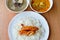 Sausage on rice with Bamboo shoot curry and soup