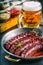 Sausage. Roasted chorizo sausage. Roasted spicy sausage chorizo home hotel or restaurant with beer vine brandy cognac whiskey.