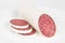 Sausage slices on a white background, salami