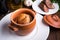 Sausage Yorkshire pudding in the baking pot on wooden background close up