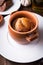 Sausage Yorkshire pudding in the baking pot on wooden background close up