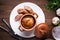 Sausage Yorkshire pudding in the baking pot on wooden background top view