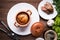 Sausage Yorkshire pudding in the baking pot on wooden background top view