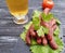 Sausages beer salad leaf pork board organic traditional dinner gourmet kitchen on a wooden background lettuce table