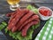 Sausages beer salad leaf recipe dish fried kitchen on a wooden background lettuce table