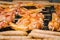 Sausages and chicken wings on smoking grill barbeque