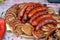 Sausages cooked on the grill during the food festival.