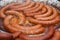 Sausages Frying In A Skillet