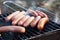 Sausages on the grill fire grate barbecue