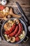 Sausages. Grill sausages. Grilled sausage with mushrooms garlic tomatoes and onions