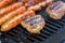 Sausages and Hamburgers on Grill