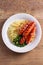 Sausages, mashed potatoes, green peas and onion gravy. Homemade Bangers and Mash.