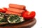 Sausages served on wooden plate