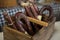 Sausages in wooden basket at counter in market