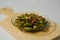 Sauteed green beans and anchovies in a small plate