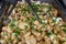 Sauteed mushrooms with garlic and parsley served during catering event