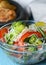 Sauteed vegetable salad with broccoli, asparagus, sweet pepper and cellophane noodles or fensi noodles in a glass bowl