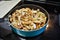 Sauteing mushrooms and onions in a frying pan with oil, seasoning, and steam