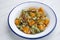 Sautéed pumpkin with broad beans. Traditional Spanish recipe.