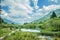 Sava Dolinka river and some tourists at the Zelenci Nature Reserve in Kranjska Gora, Slovenia