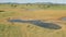 Savanna landscape with water hole