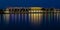 Savannah Convention Center lighting reflects on the Savannah River during blue hour