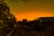 Savannah Sunset at Amboseli National Park with amidst cabins and acacia trees