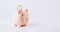 Save currency bitcoin. Pink pig bank with golden bit coin money BTC on white background. Save money investment and