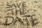 Save the date concept written on sand beach