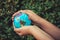 Save The Earth and Care Environment Concept, Close-up Portrait of Woman is Holding Mockup Global in Her Hands on Tree Leave