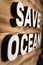SAVE OCEAN words made with building blocks lying on wooden board