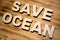 SAVE OCEAN words made with building blocks lying on wooden board