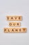 Save our planet made from wooden blocks.