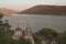 Savina Monastery - Serbian Orthodox monastery against the backdrop of a mountain range and the Bay of Kotor at sunset