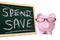 Saving plan, Piggy Bank with blackboard and spend save message