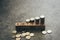 SAVING wood cube block with coin on black background with copy space. Concept of saving and deposit, business wealth, income or