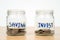 Saving word and Invest word with money coin in glass jar