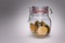 Savings: golden bitcoin coins in a glass jar