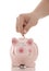 Savings - Piggy bank and hand