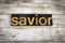 Savior Letterpress Word on Wooden Background