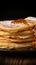 Savor the detail close up of delicate thin pancakes on wood