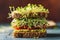 Savor the freshness of a multi-layered sandwich overflowing with vibrant green sprouts. AI Generated