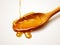 Savor the Sweet Simplicity: Enchanting Image of Honey Dripping from a Wooden Spoon