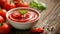 Savoring the Flavors: Closeup of Delicious Ketchup and Tomato Bowl on a Wooden Table