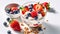 Savoring Homemade Yogurt with Fresh Strawberries, Berries, and Cereals on a White Background. Generative AI