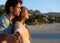 Savoring the moment. a loving young couple standing on the beach looking at the view.