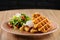 Savory Belgian waffles with egg poached, bacon and salad