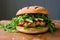 Savory Chicken Burger Garnished with Onions and Arugula.